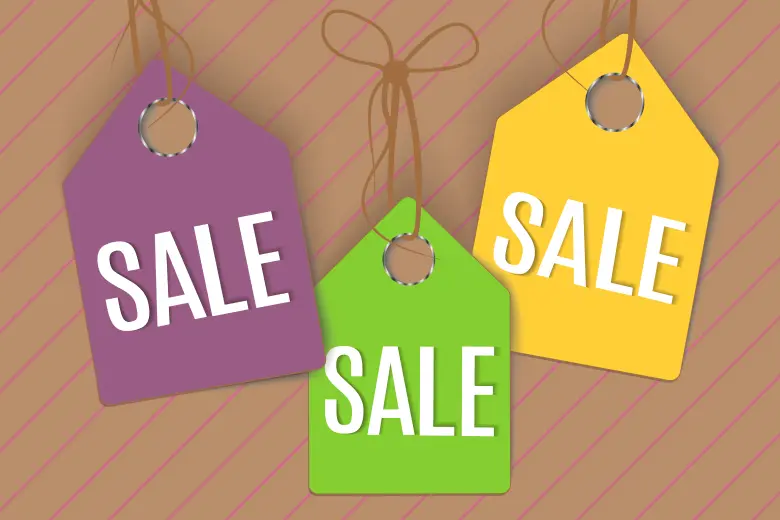 Three colorful price tags (purple, green, yellow) with "SALE" on each, on a light brown background with pink diagonal lines.