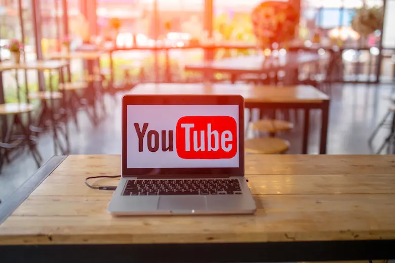 laptop displayed youtube logo representing list of educational youtube channels