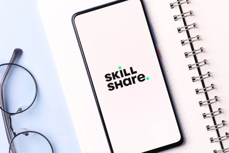 Mobile Phone Displays a Skillshare logo on it 