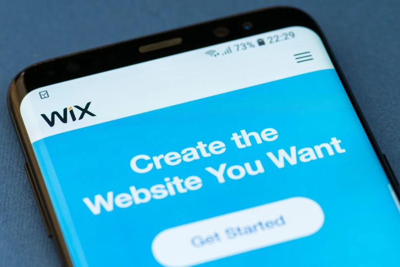 Wix mobile app screen showing 'Create the Website You Want' prompt