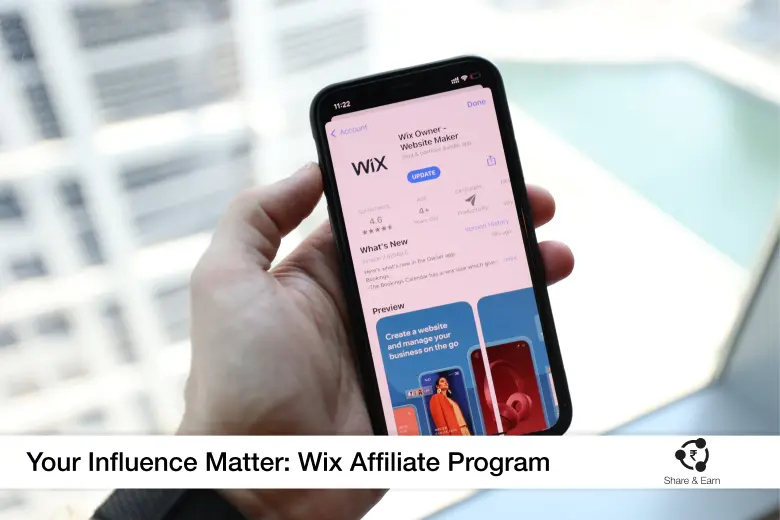 A Person holding a phone and its displays wix affiliate program app