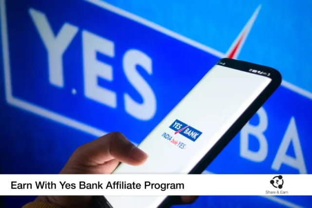 A person holding a cell phone in front of a yes bank sign